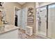 Well-appointed bathroom with a glass-enclosed shower, and a view of walk-in closet at 24066 N 167Th Ln, Surprise, AZ 85387