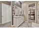 Well-lit bathroom features double vanity, and a walk-in closet at 24066 N 167Th Ln, Surprise, AZ 85387