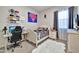 This cozy bedroom features a study desk, gaming chair, and decoratively coordinated bedding at 24066 N 167Th Ln, Surprise, AZ 85387