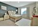 Comfortable bedroom with carpet, large window, and elegant furnishings at 24066 N 167Th Ln, Surprise, AZ 85387