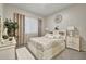 Cozy bedroom showcasing a decorative headboard, bedside tables, and soft carpet flooring at 24066 N 167Th Ln, Surprise, AZ 85387