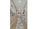 Hallway with luxury vinyl floors, decorator lighting and artwork at 24066 N 167Th Ln, Surprise, AZ 85387