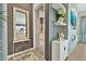 Stylish hallway features modern decor, tiled floors, and leads to kitchen at 24066 N 167Th Ln, Surprise, AZ 85387