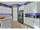 Modern kitchen with stainless steel appliances, granite countertops, and stylish white cabinetry at 24066 N 167Th Ln, Surprise, AZ 85387