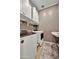 Well-organized laundry room with washer, dryer, folding table and storage at 24066 N 167Th Ln, Surprise, AZ 85387