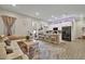 This bright living area offers stylish seating, modern decor, and a view of the kitchen at 24066 N 167Th Ln, Surprise, AZ 85387