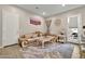 This elegant living room features a plush sectional sofa and a marble-topped coffee table at 24066 N 167Th Ln, Surprise, AZ 85387