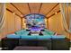 Luxurious outdoor lounge area with plush seating and string lights, perfect for entertaining and relaxing by the pool at 24066 N 167Th Ln, Surprise, AZ 85387