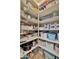 Well-organized pantry with multiple shelves and baskets provides ample storage for food and kitchen supplies at 24066 N 167Th Ln, Surprise, AZ 85387