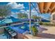 Outdoor pool area features a built-in bar, desert landscaping, and cozy seating areas with a serene ambiance at 24066 N 167Th Ln, Surprise, AZ 85387
