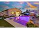 Stunning pool and backyard, featuring desert mural, comfortable seating, and lush landscaping for ultimate relaxation at 24066 N 167Th Ln, Surprise, AZ 85387