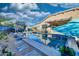 Beautiful swimming pool with an integrated spa, desert landscaping, and multiple seating areas for ultimate relaxation at 24066 N 167Th Ln, Surprise, AZ 85387