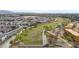 An aerial view of the community and a large green space with walking paths and a playground at 2850 N 152Nd Ln, Goodyear, AZ 85395