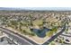 Aerial shot of the community showcasing the neighborhood's serene lake, walking trails, and well-manicured green spaces at 2850 N 152Nd Ln, Goodyear, AZ 85395