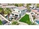 Aerial view of the property showcasing a private pool, lush lawn, and outdoor living space at 2850 N 152Nd Ln, Goodyear, AZ 85395