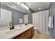 Bathroom features double sinks, updated vanity, and tile floors at 2850 N 152Nd Ln, Goodyear, AZ 85395