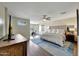 Spacious main bedroom has a ceiling fan, wood floors, and an exercise bike area at 2850 N 152Nd Ln, Goodyear, AZ 85395