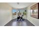 Bright exercise room features a bay window, wood floors, and exercise equipment at 2850 N 152Nd Ln, Goodyear, AZ 85395