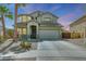Charming two-story home with desert landscaping, a two car garage and a welcoming front entrance at 2850 N 152Nd Ln, Goodyear, AZ 85395