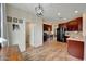 Spacious kitchen featuring wood cabinetry, stainless steel appliances, and wood-look flooring at 2850 N 152Nd Ln, Goodyear, AZ 85395