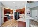Kitchen with stainless steel appliances, mosaic backsplash, white countertops and wood-look floors at 2850 N 152Nd Ln, Goodyear, AZ 85395