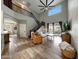 Open-concept living space featuring wood-look tile flooring, tall ceilings, and a view to the backyard patio at 2850 N 152Nd Ln, Goodyear, AZ 85395
