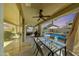 Spacious covered patio with dining set overlooking the pool, a grill, and outdoor seating with a view of the sunset at 2850 N 152Nd Ln, Goodyear, AZ 85395
