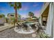 Beautiful pool area with lounge chairs, desert landscaping, and shade umbrellas, perfect for relaxing outdoors at 2850 N 152Nd Ln, Goodyear, AZ 85395