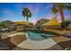 Relaxing backyard pool area featuring lounge chairs, mature palm trees, and shade coverings at 2850 N 152Nd Ln, Goodyear, AZ 85395