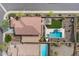 Aerial view of the property showcasing the pool, landscaping, patio area, and overall layout of the backyard at 31106 N 130Th Ln, Peoria, AZ 85383