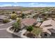 Desert home featuring lush landscaping, a red tile roof, and a backyard oasis with a pool and artificial grass at 31106 N 130Th Ln, Peoria, AZ 85383