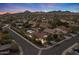 Aerial shot of the home and neighborhood showcasing the beautiful desert landscape and the community at 31106 N 130Th Ln, Peoria, AZ 85383