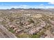 Expansive aerial view showcases the community and distant mountains surrounding the neighborhood at 31106 N 130Th Ln, Peoria, AZ 85383