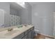 Bathroom features double sink vanity with a shower and tub combination at 31106 N 130Th Ln, Peoria, AZ 85383