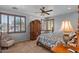 Cozy bedroom with comfortable bed and plantation shutters, creating a serene atmosphere at 31106 N 130Th Ln, Peoria, AZ 85383
