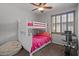Bedroom with bunk beds, workout equipment, and a ceiling fan at 31106 N 130Th Ln, Peoria, AZ 85383