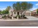 Charming single-story home featuring a desert-landscaped front yard and an attached two-car garage at 31106 N 130Th Ln, Peoria, AZ 85383