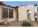 Inviting front entrance with stone accents, a brick pathway, and updated lighting fixtures create a welcoming ambiance at 31106 N 130Th Ln, Peoria, AZ 85383