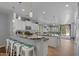 Spacious kitchen with island seating and stainless steel appliances offers ample counter space at 31106 N 130Th Ln, Peoria, AZ 85383