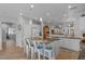 Expansive kitchen island offers seating and prep space, perfect for entertaining at 31106 N 130Th Ln, Peoria, AZ 85383