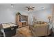 Comfortable living room boasts a large TV, plush seating, and a game table at 31106 N 130Th Ln, Peoria, AZ 85383