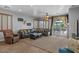 Bright and airy living room leads to outdoor dining and entertaining area at 31106 N 130Th Ln, Peoria, AZ 85383