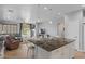 Open floor plan showcases living room with fireplace and views of the backyard pool at 31106 N 130Th Ln, Peoria, AZ 85383