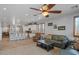 Open living room with island seating, fireplace, and an inviting atmosphere at 31106 N 130Th Ln, Peoria, AZ 85383