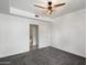 This cozy bedroom has neutral-toned walls and carpet, leading to a bathroom with a shower-tub combination at 3302 N 7Th St # 211, Phoenix, AZ 85014