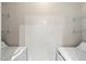 Functional laundry room with side-by-side machines and ample shelving for organized storage at 3302 N 7Th St # 211, Phoenix, AZ 85014