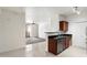 Open concept living space showcasing a kitchen, living room, and balcony access, perfect for modern living at 3302 N 7Th St # 211, Phoenix, AZ 85014