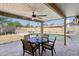 Inviting backyard with pool, dining table, and covered patio, great for entertaining at 3830 E Desert Cove Ave, Phoenix, AZ 85028