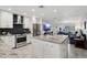 Modern kitchen features granite countertops, stainless steel appliances, and a spacious island at 3830 E Desert Cove Ave, Phoenix, AZ 85028