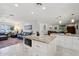 Spacious open kitchen with granite island flows into the comfortable living room at 3830 E Desert Cove Ave, Phoenix, AZ 85028